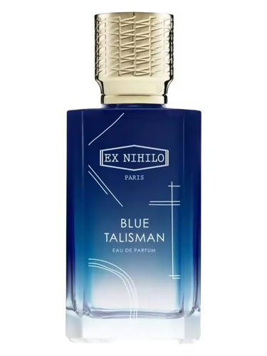 Gradient blue Ex Nihilo Blue Talisman bottle with gold textured cap, showcasing minimalist Parisian design on transparent glass